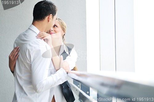 Image of romantic happpy couple on balcony