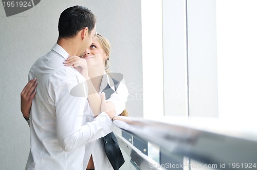 Image of romantic happpy couple on balcony