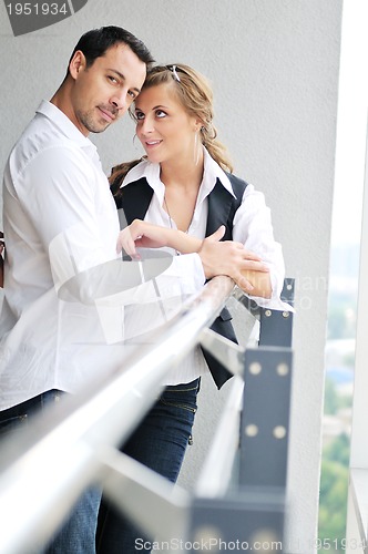Image of romantic happpy couple on balcony