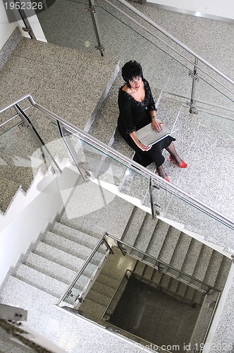 Image of senior woman work on laptop