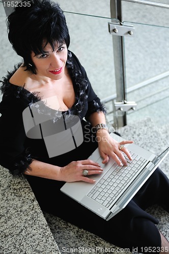 Image of senior woman work on laptop