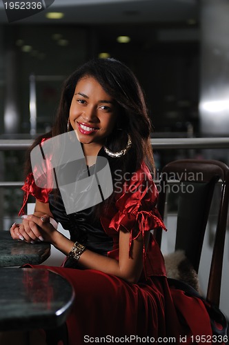 Image of business woman in red dress smilling