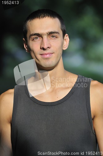 Image of  young casual man outdoor portrait smiling