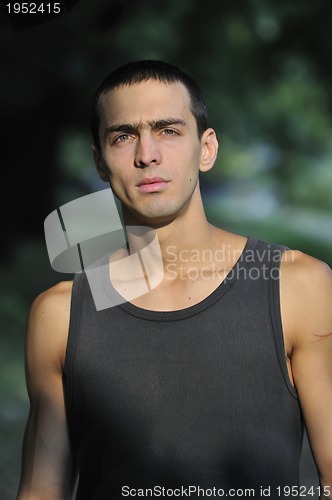 Image of  young casual man outdoor portrait smiling