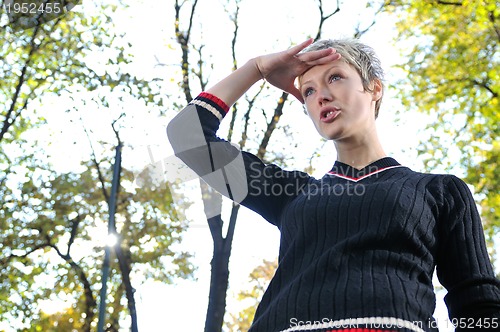 Image of blonde Cute young woman looking out 