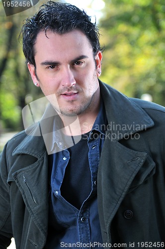 Image of happy young casual man outdoor portrait posing