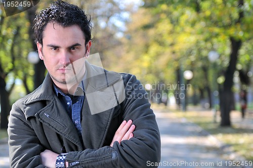 Image of happy young casual man outdoor portrait posing