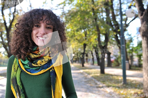 Image of Young curly woman smiling 