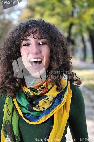 Image of brunette Cute young woman  smiling 
