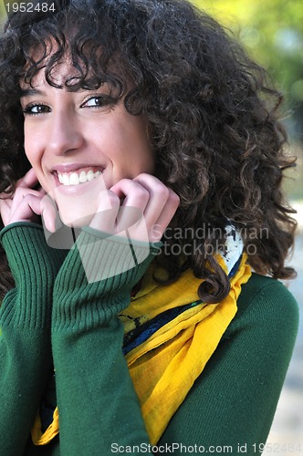 Image of Young curly woman smiling 