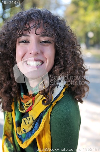 Image of Young curly woman smiling 