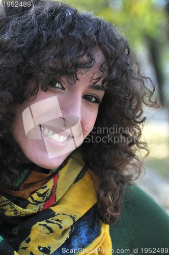 Image of Young curly woman smiling 