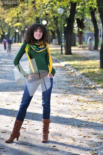 Image of brunette Cute young woman  posing outdoors