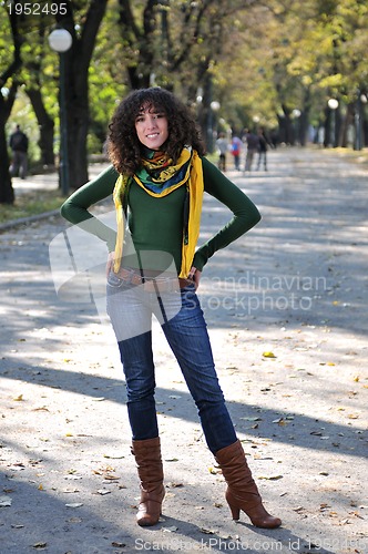 Image of brunette Cute young woman  posing outdoors