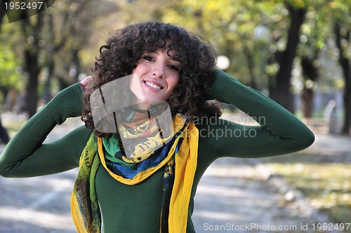 Image of brunette Cute young woman  smiling 