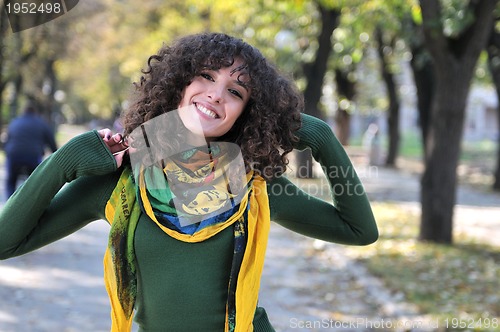Image of brunette Cute young woman  smiling 