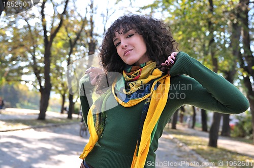 Image of brunette Cute young woman  posing outdoors