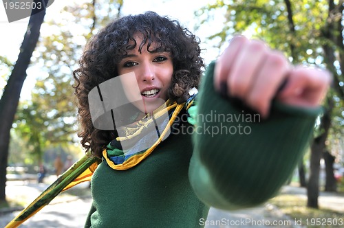 Image of brunette Cute young woman  posing outdoors