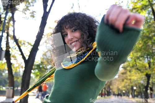 Image of Young curly woman smiling 