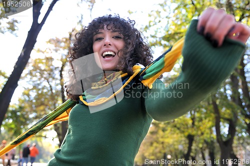 Image of Young curly woman smiling 