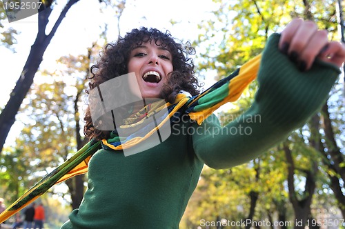 Image of brunette Cute young woman  posing outdoors