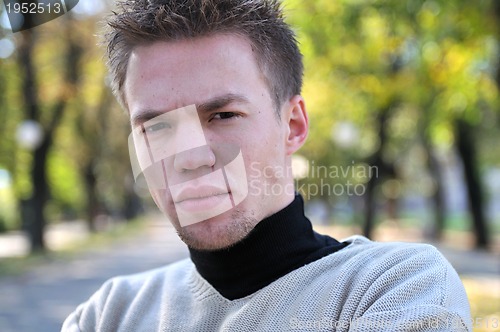 Image of happy young casual man outdoor portrait posing