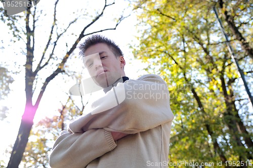 Image of happy young casual man outdoor portrait posing