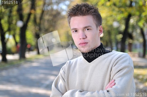 Image of happy young casual man outdoor portrait posing