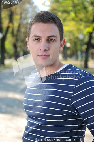 Image of Handsome young man looking