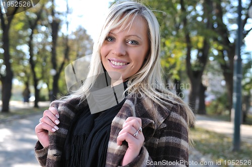 Image of Cute young woman smiling 