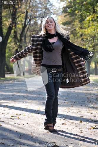 Image of Cute young woman smiling 