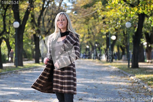 Image of Cute young woman smiling 