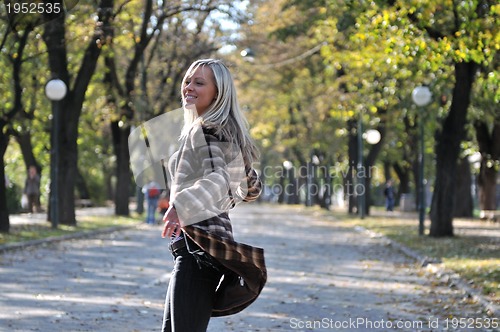 Image of Cute young woman smiling 