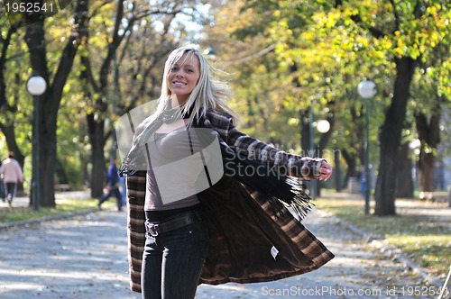 Image of Cute young woman smiling 