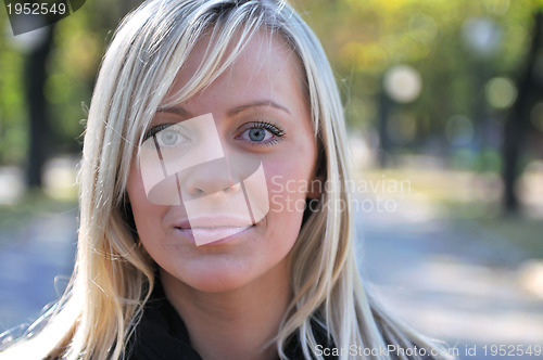 Image of Cute young woman smiling 