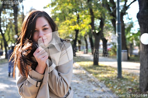 Image of Cute young woman smiling 