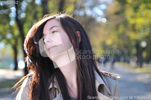 Image of Cute young woman smiling 