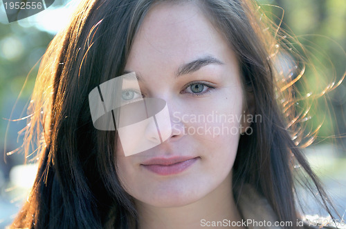 Image of Cute young woman smiling 