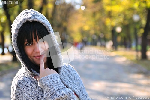 Image of brunette Cute young woman smiling outdoors