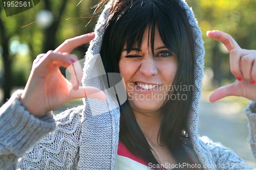 Image of brunette Cute young woman  posing outdoors