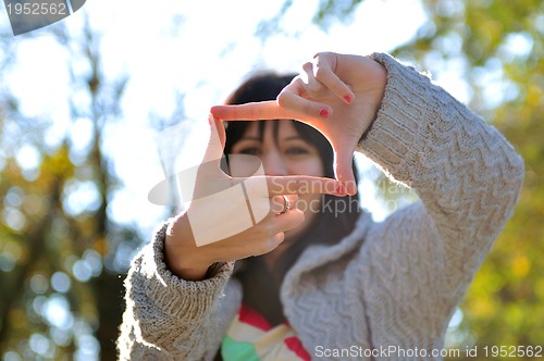 Image of brunette Cute young woman  posing outdoors