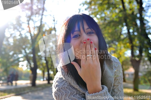 Image of brunette Cute young woman  posing outdoors