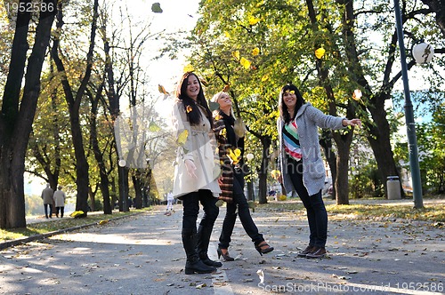 Image of Happy three friends  outdoors