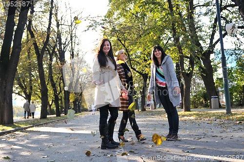 Image of Happy three friends  outdoors