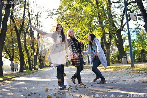 Image of Happy three friends  outdoors