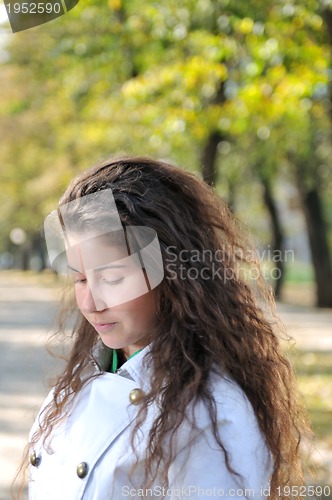 Image of brunette Cute young woman posing outdoors