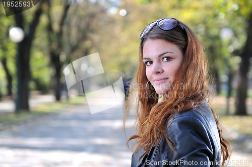 Image of brunette Cute young woman posing outdoors