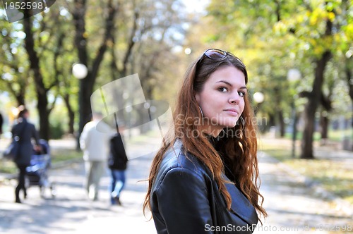 Image of brunette Cute young woman posing outdoors