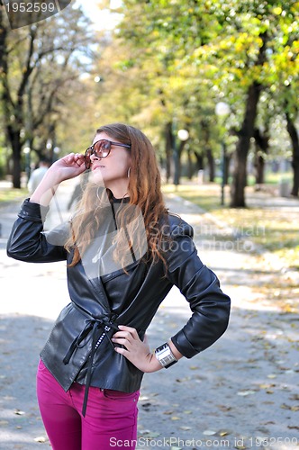 Image of brunette Cute young woman posing outdoors