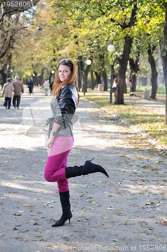 Image of brunette Cute young woman posing outdoors